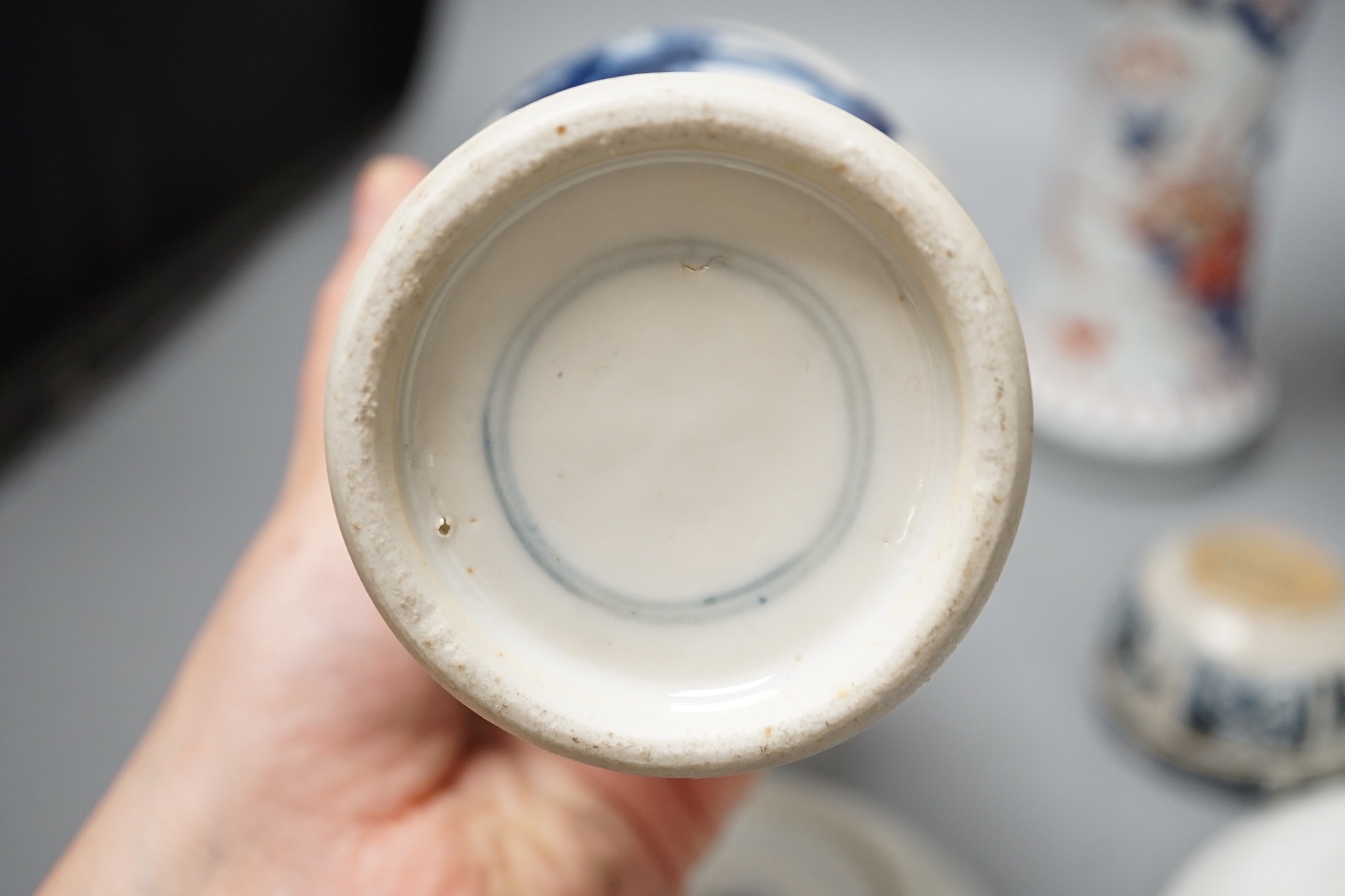 A Japanese Edo period Imari vase, 22. 5 cm, two 19th-century Chinese blue and white baluster vases, an Annamese blue and white box and cover, a Chinese famille rose plates and a blue and white dish